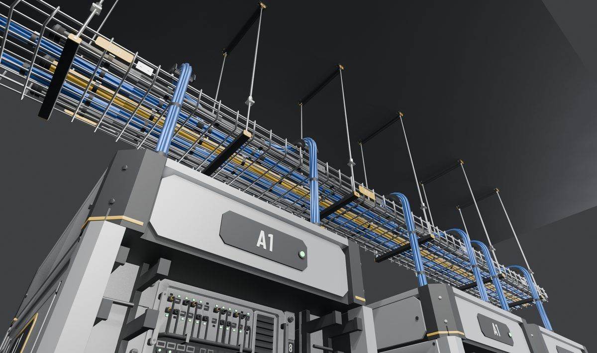 Cables dropping from a tray over a curved guide into a rack, with ceiling rod hangers